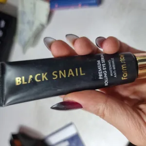 Poza reala Ser Concentrat pentru Zona Ochilor cu Mucina de Melc Negru Farmstay Premium Rolling Eye Serum